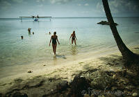 Brazil, Salvador de Bahia, Catalina PBY-5a flying boat and pasengers on beach. Peter Stuyvesant Travel Odyssey 1993/1994.