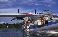 Brazil, Manaus, Young man diving in water of Rio Negro from Catalina PBY-5A hydroplane. Peter Stuyvesant Travel Odyssey 1993/1994.
