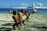 Brazil, Salvador de Bahia, Catalina PBY-5A hydroplane being pulled on beach after landing. Peter Stuyvesant Travel Odyssey 1993/1994.